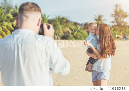 Father, Mother and Kid with relax activity, walking and playing on the tropical beach Father, Mother and Kid with relax activity, walking and playing on the tropical beach 41916258