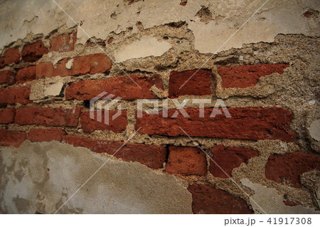 Old cement wall with paint peeling off. Old cement wall with paint peeling off. 41917308