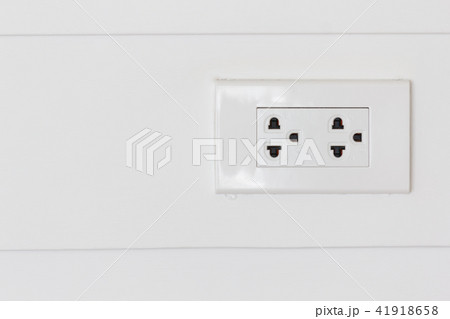 White plugs on white wood wall. 41918658