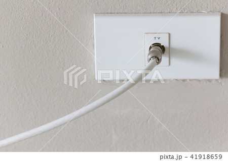 White tv plug on white wall. 41918659
