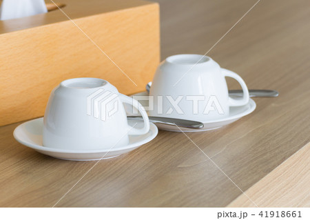 White cups coffee set on wooden table. White cups coffee set on wooden table. 41918661