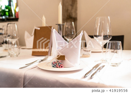 Table setup at marriage waiting for guests with dishes water flowers 41919556