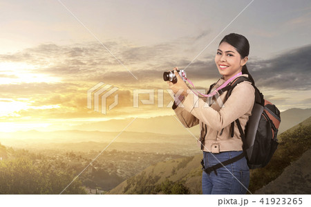 Beautiful asian photographer woman with camera  41923265