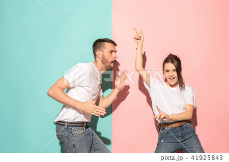 A couple of young man and woman dancing hip-hop at studio. A couple of young man and woman dancing hip-hop at studio. 41925843
