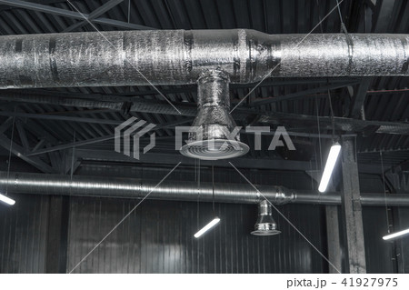 Ventilation system on the ceiling of large buildings. Ventilation pipes in silver insulation 41927975