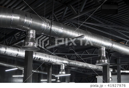 Ventilation system on the ceiling of large buildings. Ventilation pipes in silver insulation 41927976