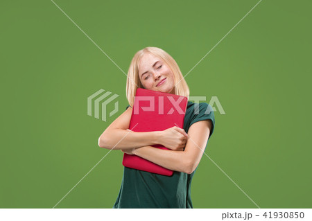 Businesswoman hugging laptop. Love to computer concept. Attractive female half-length front portrait Businesswoman hugging laptop. Love to computer concept. Attractive female half-length front portrait 41930850