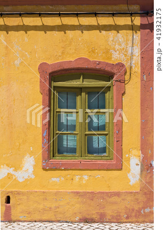 Yellow house with orange details and a window Yellow house with orange details and a window 41932175