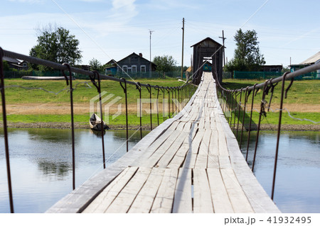 Rural landscape at summer with wooden bridge Rural landscape at summer with wooden bridge 41932495