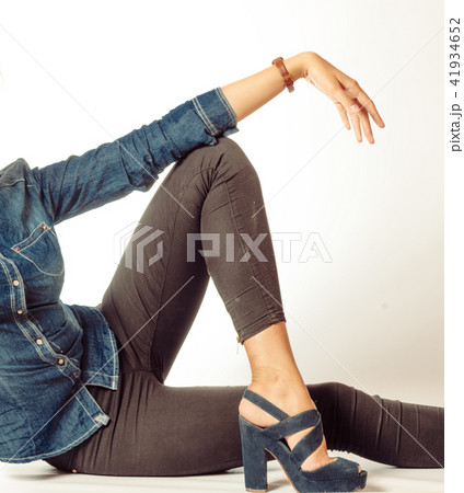 long girlish legs in jeans and hand on a lot of copyspace 41934652
