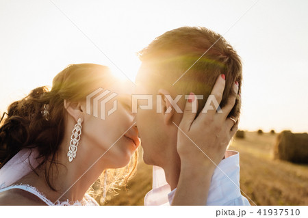 Groom and bride on sunset background Groom and bride on sunset background 41937510