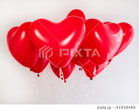 Red balloons in the shape of a heart 41938469