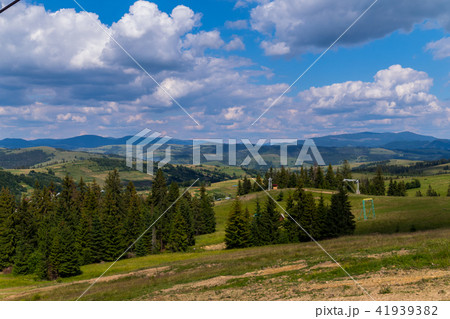 mountain landscape, green slopes, and, ski lifts a 41939382