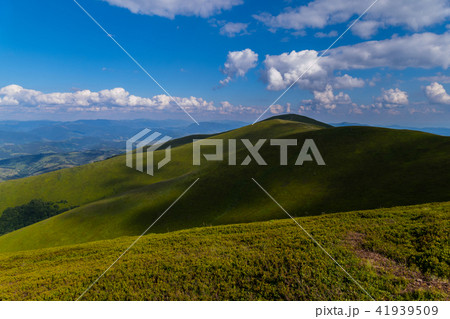 A deep blue sky with white clouds lying over mount A deep blue sky with white clouds lying over mount 41939509