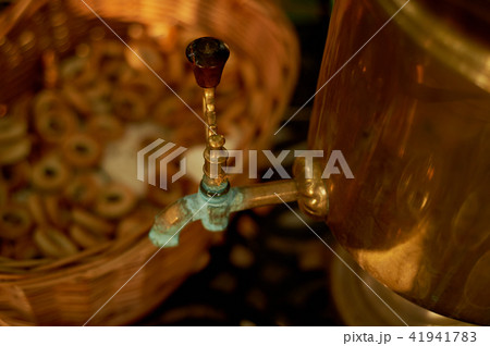Russian samovar with steering wheels.Traditional tea party Russian samovar with steering wheels.Traditional tea party 41941783
