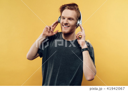Portrait of Happy Smiling Guy Listening to Music Portrait of Happy Smiling Guy Listening to Music 41942067