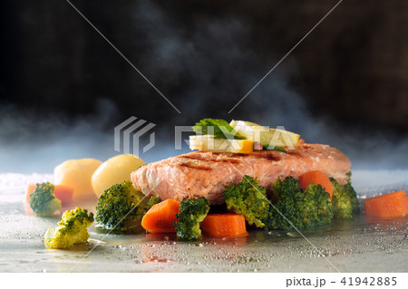 Salmon and steamed vegetables. Salmon and steamed vegetables. 41942885