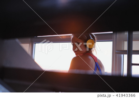 Young Woman Listening To Music With Wireless Earphones Young Woman Listening To Music With Wireless Earphones 41943366