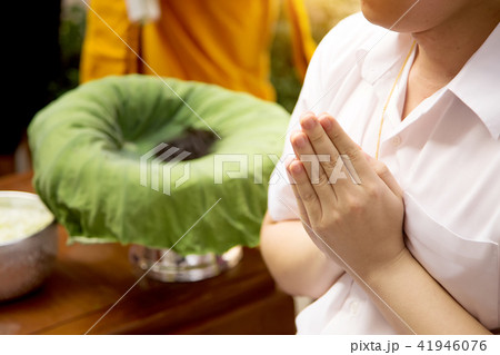 close up praying hand of man in priest ceremony 41946076