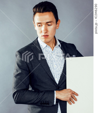 young handsome modern hipster businessman posing emotional, happ 41946290