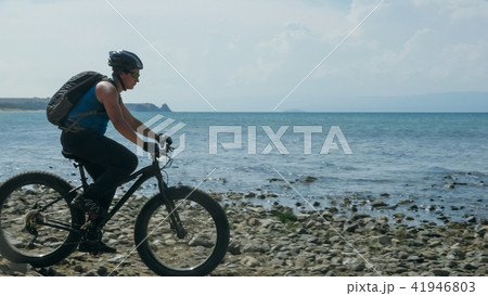 Fat bike also called fatbike or fat-tire bike in summer driving on the beach. Fat bike also called fatbike or fat-tire bike in summer driving on the beach. 41946803