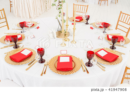 Beautiful banquet hall under a tent for a wedding reception. Interior of a wedding tent decoration 41947908