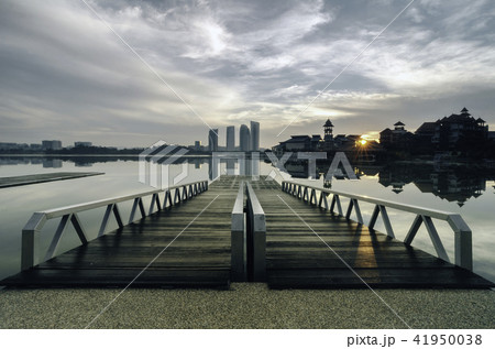 Modern wooden jetty near the lakeside Modern wooden jetty near the lakeside 41950038