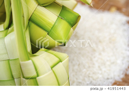 ketupat casing and rice in bamboo container ketupat casing and rice in bamboo container 41951443
