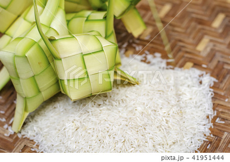 ketupat casing and rice in bamboo container 41951444