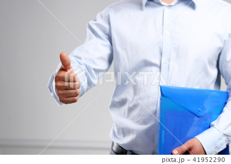 Handsome young businessman showing ok Handsome young businessman showing ok 41952290