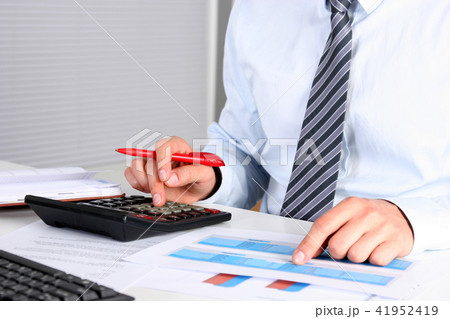 businessman sitting at the table with laptop. businessman sitting at the table with laptop. 41952419