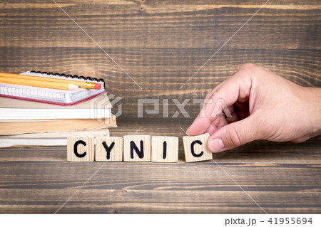cynic. Wooden letters on the office desk cynic. Wooden letters on the office desk 41955694