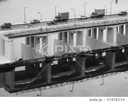 Toy model figure cars on bridge across river scene Toy model figure cars on bridge across river scene 41956254