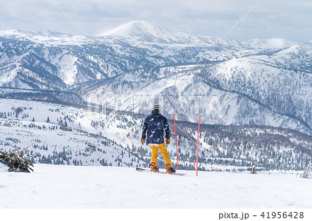 Skiers and snowboarder prepare to start Skiers and snowboarder prepare to start 41956428