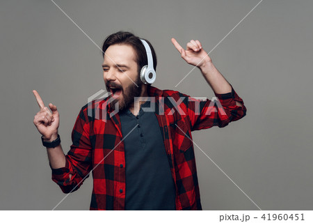 Happy Young Man Listening to Music with Headphones Happy Young Man Listening to Music with Headphones 41960451