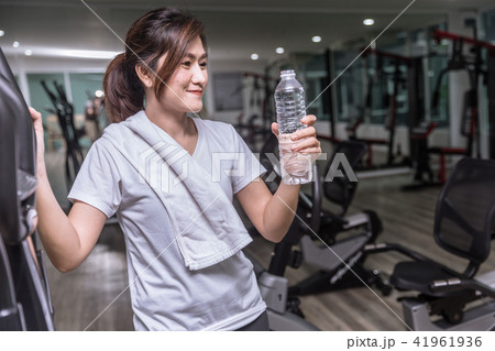 asian girl hand hold drinking water bottle in club 41961936