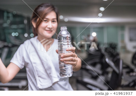 healthy asian woman hand hold show bottle of drink 41961937