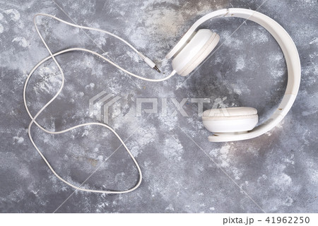 Headphones for music sound. Isolated on gray stone background Headphones for music sound. Isolated on gray stone background 41962250