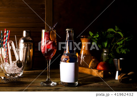 alcohol cocktail with fresh fruits and berries with a bottle of tonic and a place under the text on alcohol cocktail with fresh fruits and berries with a bottle of tonic and a place under the text on 41962432
