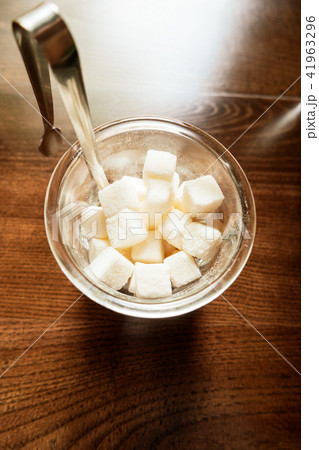 Sugar in the bowl top view on wooden background 41963296