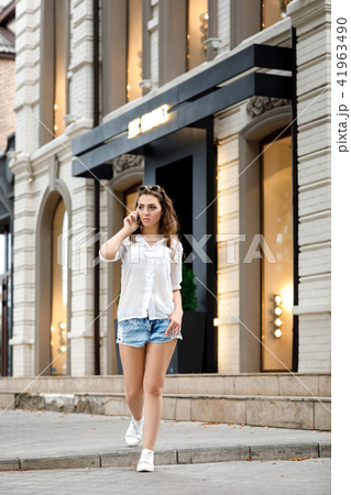 young woman talking on the phone 41963490