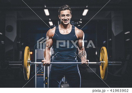 Handsome model young man workout in gym 41963902