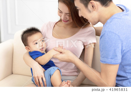 Portrait of young happy family with baby Portrait of young happy family with baby 41965831