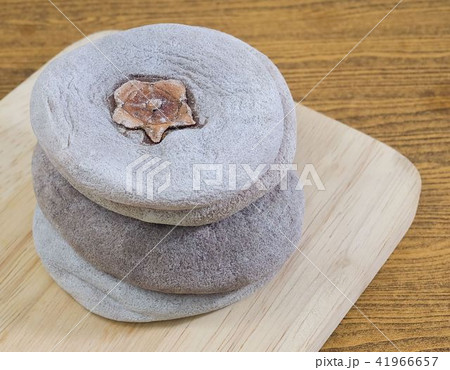 Dried Kaki or Persimmon Fruits on Wooden Tray Dried Kaki or Persimmon Fruits on Wooden Tray 41966657