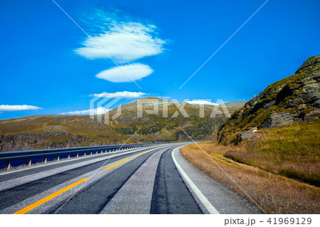 Mountain road along the fjord 41969129