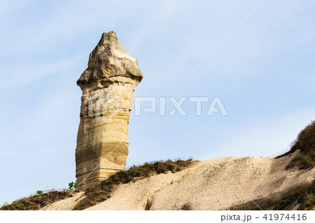fairy chimney rock on mountain slope in Goreme fairy chimney rock on mountain slope in Goreme 41974416