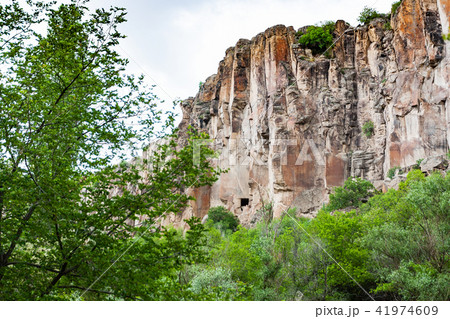 rocky wall of gorge of Ihlara Valley in Cappadocia rocky wall of gorge of Ihlara Valley in Cappadocia 41974609