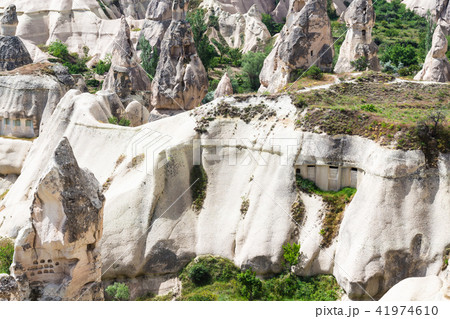 ancient rocks houses on mountaion slope in Goreme 41974610