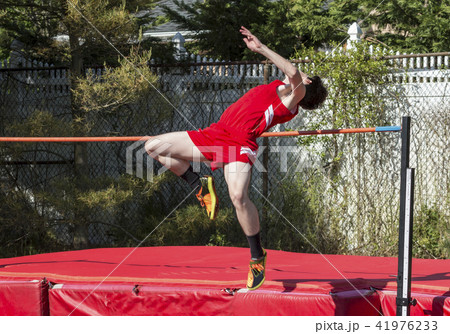 High jumper clearing the bar High jumper clearing the bar 41976233