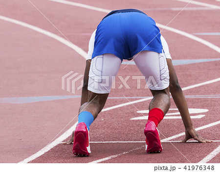 Sprinter in set position at race start 41976348